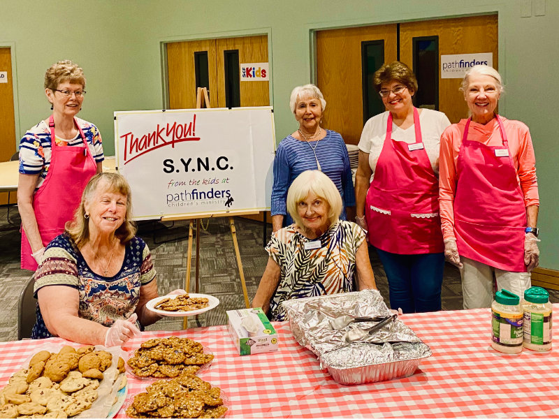SYNC Ladies serving dinner for Pathfinders Children's Ministry