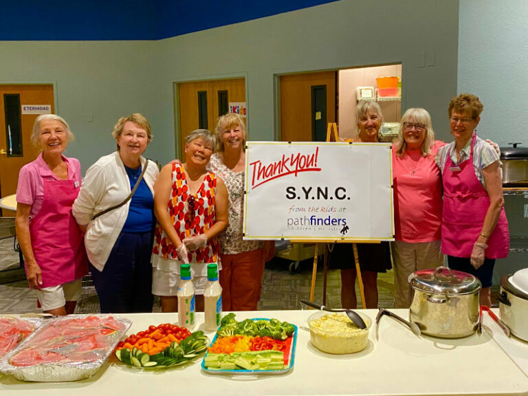 SYNC Ladies serving dinner for a Pathfinders Children's Ministry dinner